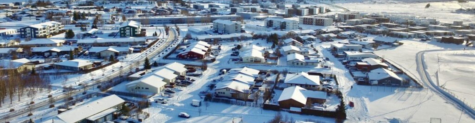 Vehicles lined up for road trip in Mosfellsbær surroundings